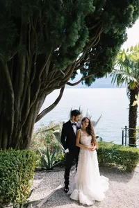 Couple embracing in terraced gardens at Hotel Villa Cipressi