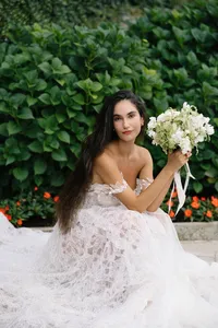 Close bridal portrait with classic white and green bouquet on Lake Como gardens during elopement