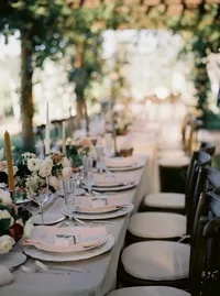 Romantic sunset reception table styling with lush florals and candlelight at a Lake Oswego Oregon winery wedding.