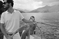 Bride enjoying private sail on Lake Como after elopement