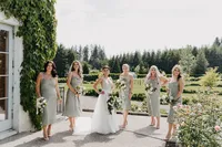 Bride and bridesmaids at private estate wedding in Vancouver, Washington with garden setting.