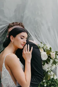 Bride holding blush and white bouquet at private estate wedding in Vancouver, Washington.