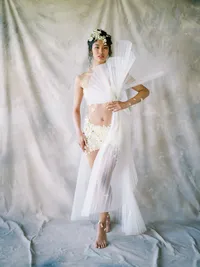Full bridal fashion look with structured elements and sheer textures