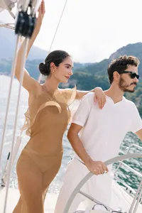 Couple aboard sailboat during Lake Como elopement experience