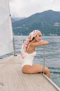 Bride enjoying private sail on Lake Como after elopement