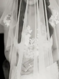 Black and white film portrait of bride with veil and wedding ring detail during preparations for the Lake Oswego Oregon winery wedding.