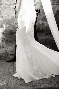 Detailed view of the Pronovias wedding gown with delicate beaded embroidery and silk fabric during a romantic Lake Oswego Oregon winery wedding.