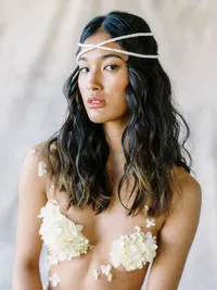 Close-up bridal portrait with natural makeup and floral details