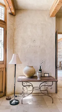 Natural stone entryway inside Sunstone Winery filled with warm light in Santa Ynez Valley.