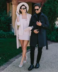 Bride and groom walking side by side along a gravel garden path, a candid moment from a Santa Barbara wedding editorial by Yuliya Supin Design