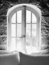Black and white architectural interior of the Sunstone Winery stone villa in the Santa Ynez Valley.
