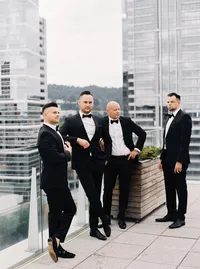 Groom and groomsmen portrait on the rooftop of the Nines Hotel in Portland before the Lake Oswego Oregon winery wedding celebration.