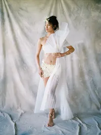 Fashion bridal editorial with structured fan and modern styling