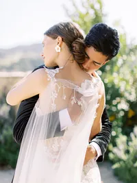 Close-up portrait of bride and groom sharing a quiet moment before ceremony at Sunstone Winery wedding.