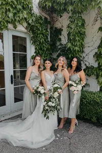 Bride with bridesmaids in sage green dresses at private estate wedding in Vancouver, Washington.
