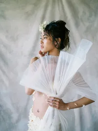Bridal portrait with fan detail and modern fashion styling