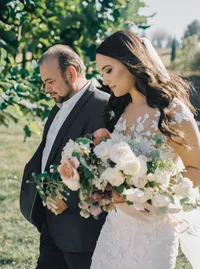 Bride walking down the garden path with her father toward the ceremony during a romantic Lake Oswego Oregon winery wedding.