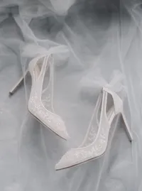 Elegant bridal shoes styled with veil on a hand-painted gray backdrop during wedding preparations for a Lake Oswego Oregon winery wedding.