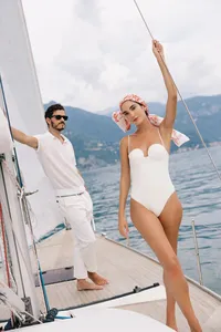 Couple aboard private sailboat during Lake Como elopement