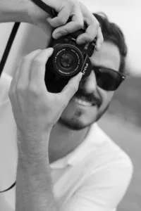 Candid groom moment with camera during Lake Como destination wedding