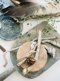 Styling with wood, branches, and organic textures in nature-inspired editorial