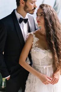 Couple embracing in terraced gardens at Hotel Villa Cipressi