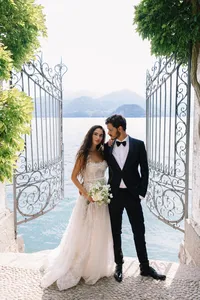 American couple portrait overlooking Lake Como at historic villa Cipressi gates