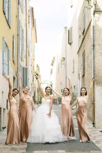 Bride and bridesmaids in a village street in Provence