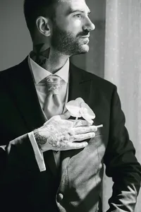 Groom getting ready for the ceremony, black and white detail