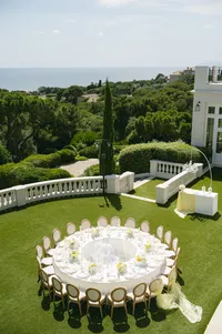 Aerial view of round reception tables set on the lawn