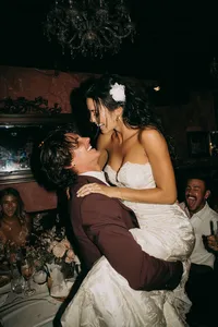 u3981682316_groom_lifting_the_bride_off_the_ground_elegant_we_54a045d9-3a65-44d1-b2ba-2021f3c39754_0