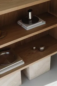 kaboompics_minimalist-oak-bookshelf-with-silver-metal-objects-42628