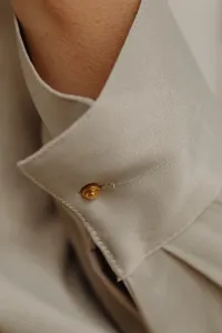 kaboompics_details-of-gold-jewelry-beautiful-woman-wearing-a-tan-silk-shirt-28036
