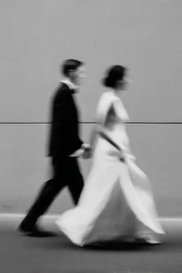 u3981682316_Close-up_of_bride_and_groom_walking_hand-in-hand__21d44acc-ca35-4050-856f-a14cf768f7a6_3