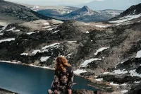 crimson conure photography's kyra eybelman took this photo of herself on beartooth pass while location scouting for an elopement and permits for beartooth pass elopements