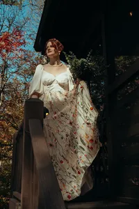 Newly married couple standing outside Airbnb cabin in North Georgia mountains for cinematic photos. Photos by Crimson Conure Photography based in Kennesaw, Georgia and Denver, Colorado