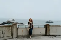 crimson conure photography's georgia and colorado based owner, Kyra Eybelman, posing for camera for a photo shoot in san fransisco in california for a photo session.