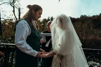 Newly married couple doing documentary and cinematic photos for their wedding / elopement at their blue ridge airbnb. Photos by Crimson Conure Photography based in Kennesaw, Georgia and Denver, Colorado