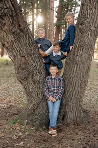 Climbing trees near Rapid City during a family photo session