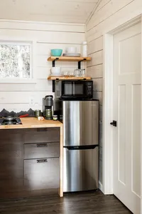 Fully equipped kitchen inside a Bluewater Basecamp chalet with essential cookware and appliances.