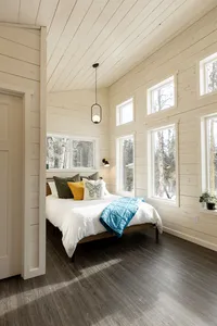 Bedroom inside a Bluewater Basecamp small chalet with premium linens and thoughtful design.