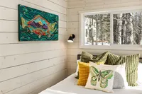 Bedroom inside a Bluewater Basecamp small chalet with premium linens and thoughtful design.