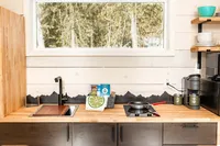 Modern kitchen inside an Alaska chalet at Bluewater Basecamp near Anchorage.