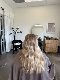 Bright, creamy toned blonde for natural looking grow out.
