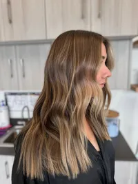Dark blonde melted highlights with the teddy bronde tones for Jacksonville girls searching for 'hairstylists near me".