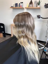 platinum, lived-in blonde using the Air Touch technique by 904 Balayage.