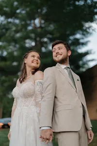bride and groom smiling at eachother after being married