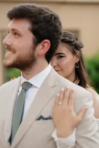 bride holding on to her groom after the first look before their wedding ceremony