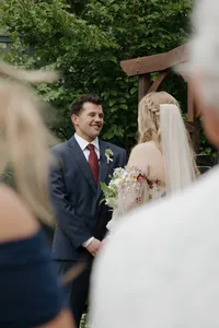 bride and groom standing at the alter