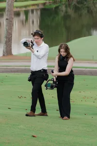 wedding photo and video duo shooting wedding photography and videography